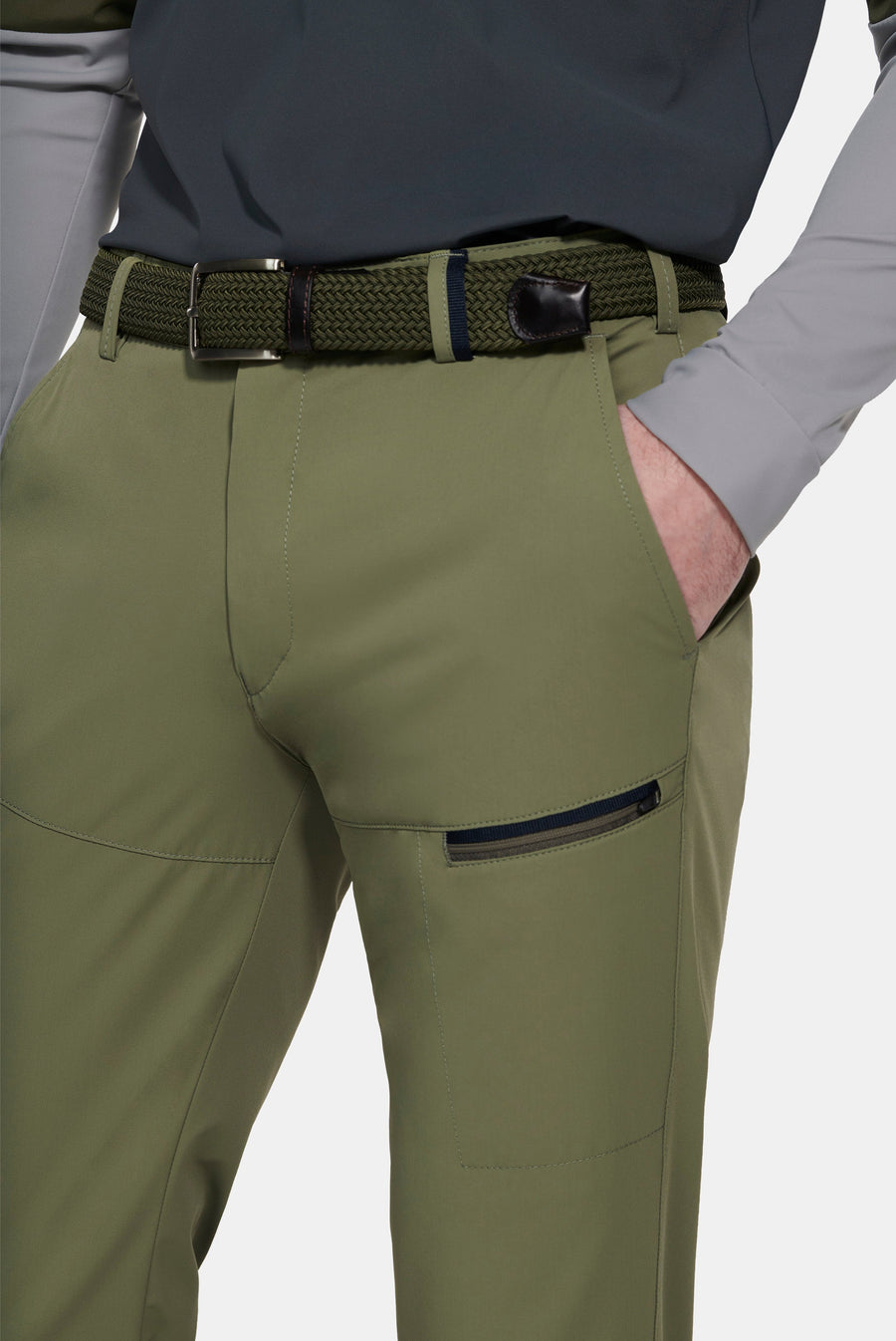 Green hiking pants with a belt on a white background
